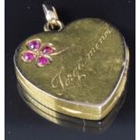 Edwardian locket set with rubies in a four leaf clover design, also engraved 'Forget me not',