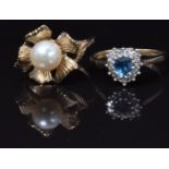 A 9ct gold ring set with a pearl and a 9ct gold ring set with a blue topaz and diamonds, 5g