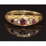An early 20thC 18ct gold ring set with rubies and diamonds, size N, 3.5g