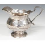 Cased Edward VII Mappin & Webb hallmarked silver Arts and Crafts jug with card cut and hammered
