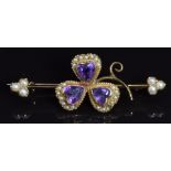 Edwardian brooch in the form of a shamrock set with heart shaped amethysts and seed pearls, 4 x 1.