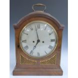 English Regency fusee mantel clock in arch topped flame mahogany case with gilt brass inset