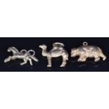 Two yellow metal charms, one in the form of a bear the other a camel, 2.3g, and a 9ct gold horse