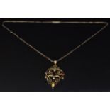 Edwardian 9ct gold pendant set with garnets and seed pearls on a 9ct gold chain, 5.3g, length 42cm