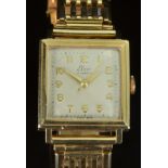 Elco 9ct gold gentleman's wristwatch with gold hands and Arabic numerals, silver dial, square case