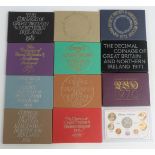 Eight Royal Mint proof UK coin sets in perspex cases with certificates, 1970-1981