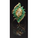 A 14k gold ring set with three marquise cut diamonds and 16 marquise cut emeralds, size P, 6g