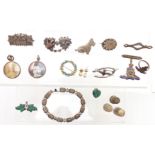A collection of silver jewellery including Victorian brooches, Victorian locket set with