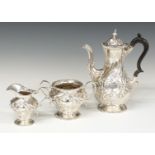 Victorian hallmarked silver three piece tea or coffee set with embossed decoration, London 1893/