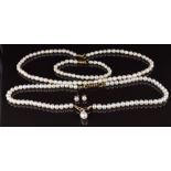 A single strand of cultured pearls with 9ct gold section set with a drop pearl, and a cultured pearl