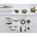 A collection of silver brooches including enamel set, thistle, Robert Allison, butterfly wing,