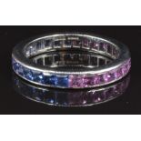 A platinum eternity ring set with square cut pink and blue sapphires, size O, 4.3g