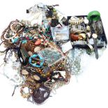 A collection of jewellery including beaded and other necklaces, bracelets, earrings, Japanese napkin
