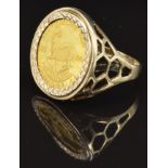 A 9ct gold ring set with a South African coin, size W, 6.5g