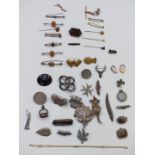 A collection of jewellery including Victorian locket, seal fob, brooches including filigree,