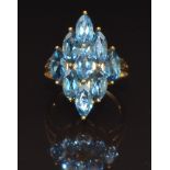 A 9ct gold ring set with marquise cut blue topaz, size N, 4.4g