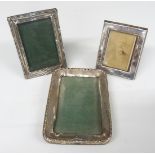 Three small hallmarked silver photograph frames including one with oak easel back, Birmingham