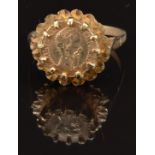 A 9ct gold ring set with a coin, size M, 3.4g