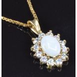 A 9ct gold pendant set with an opal surrounded by cubic zirconia, on 9ct gold chain, 2.4g, length