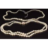 A double strand necklace of cultured pearls by JKa, the 9ct gold clasp set with pearls, and another