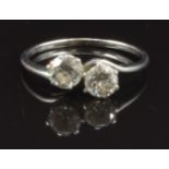 A platinum ring set with two round cut diamonds, each approximately 0.4ct, with receipt, size M, 2.