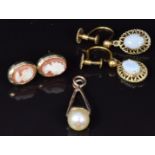 A pair of 9ct gold earrings set with opals, 9ct gold earrings set with a cameo to each (3.4g) and