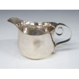 Edward VII Arts and Crafts hallmarked silver jug with hammered body, Britannia standard London 1902,