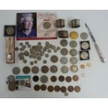 A collection of coins, hallmarked silver napkin rings, letter opener etc