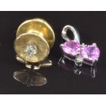 A 9ct white gold pendant set with heart cut pink sapphires and diamonds and a yellow metal pin set