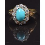 An 18ct gold ring set with a turquoise cabochon surrounded by old cut diamonds, size M, 3.4g, in