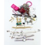 A collection of costume and silver jewellery including earrings