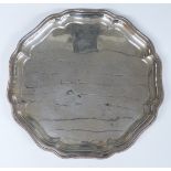 Walker & Hall modern hallmarked silver salver with shaped edge and raised on three feet,
