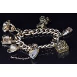 A 9ct gold charm bracelet with five 9ct gold charms including sewing machine, fob, jockey's hat