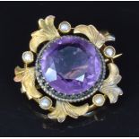 Edwardian gold pendant/ brooch set with a large round cut amethyst and seed pearls, 2.4cm, 4.5g