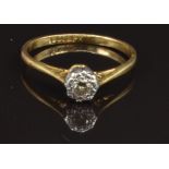 An 18ct gold ring set with a diamond in a platinum setting, size M, 1.8g