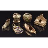 Six 9ct gold charms including post box, boot, clog, bell and 'Harrogate' enamel charm, 9.4g