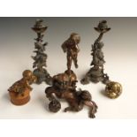 Spelter, bronze and brass items including a pair of figural candlesticks decorated with putti and