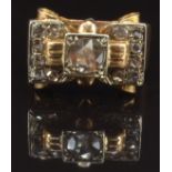 Art Deco ring set with rose cut diamonds in a stylised bow setting, the central diamond