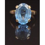 A 9ct gold ring set with an oval cut blue topaz, size S, 5.8g