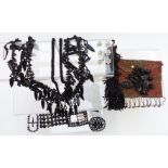 A collection of jet jewellery including necklaces, beads, buckles, cut steel beaded purse, etc
