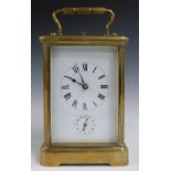 19thC or early 20thC brass cased repeating carriage clock, the white enamel dial with Roman numerals