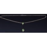 Edwardian 9ct gold necklace set with an oval and cushion cut peridot, 4.1g