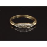 An 18ct gold ring set with diamonds, size M, 1.8g