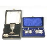 Pair of hallmarked silver mustards with blue glass liners and hallmarked silver spoon, together with