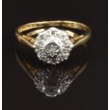 An 18ct gold ring set with diamonds in a platinum setting, size M, 2.8g