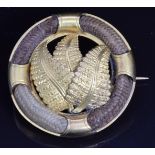 Victorian mourning brooch set with four sections of plaited hair and ferns to the centre, engraved