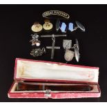 A pair of silver cufflinks, cheroot holder, T bar & cross, and insect pin