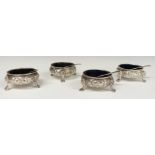 Victorian set of four hallmarked silver open salts with blue glass liners, London two 1863 and two