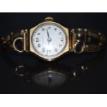 Vertex 9ct gold ladies wristwatch with blued hands, black Arabic numerals, silver dial and signed 15