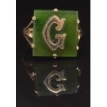 A 9ct gold signet ring set with a nephrite jade plaque with gold letter 'G' to the centre, size P,